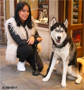 Girl and dog dressed identically