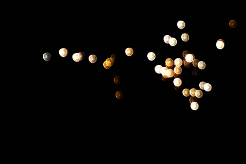 Gold and silver orbs of soft bokeh