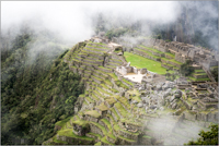 Machu Picchu seen through cloud from the Sun gate