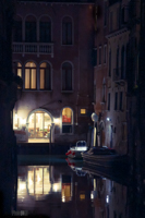 Dark photo of a Venician canal and canal-side property