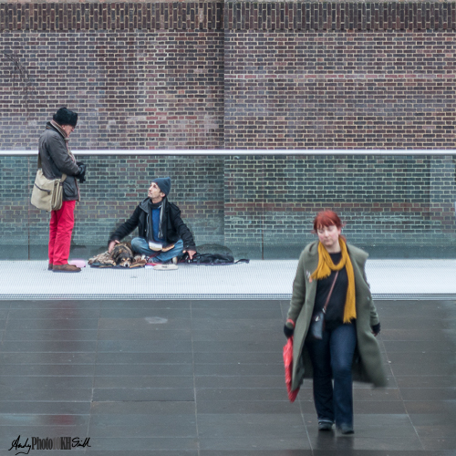 Man talking woman walking by