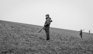 Black and white of people shooting