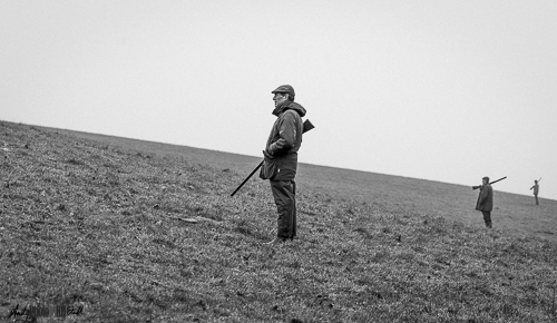 Black and white of people shooting