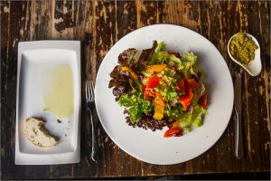 Colourful salad on wooden table