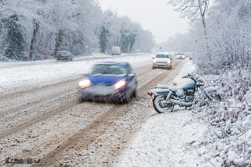 Cars and motorbike in snow
