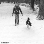Woman and Collie Dog in Snow