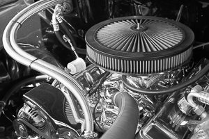 High contrast black and white of a shiny engine compartment