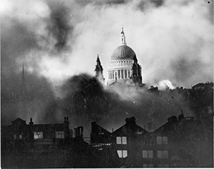 St Paul's Cathederal shrouded in smoke and debris from nazi bombing derelict bombed-out buildings in the foreground