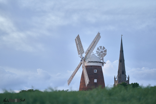 View over field to church and windmill