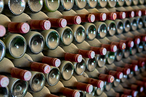 Diagonal Stacked wine bottles dusty