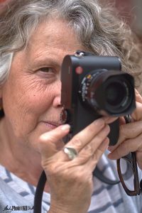 Straight on shot of Mary with her Leica