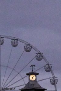 A quarter of Bournemouth Big Wheel and pier clock