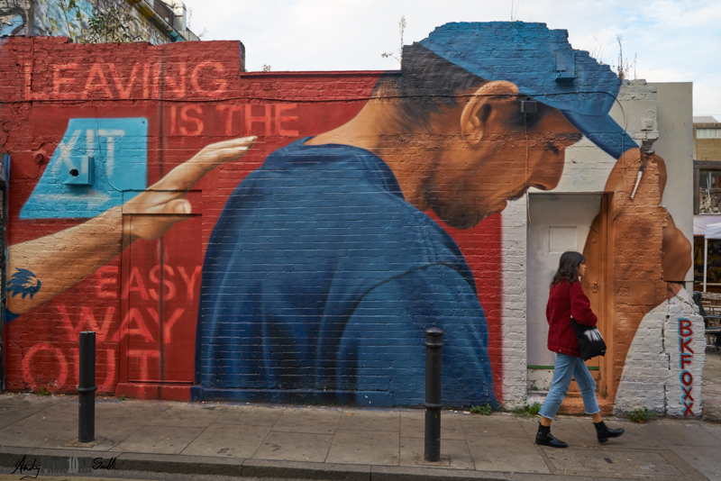 Real woman leaving graffiti man study in blue and red