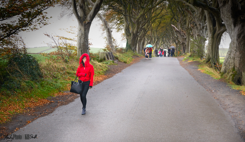 Woman in red coat on scene of game of thrones