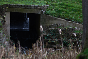 Hidden sluice gate in posh golf club