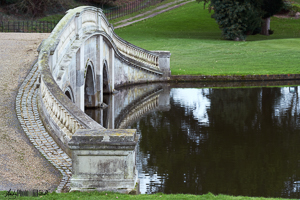 Stone bridge leading to track beyond