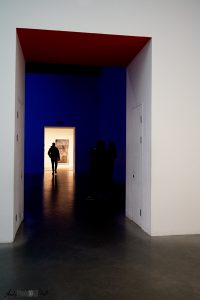 Silhouette of man frames by a series of doors