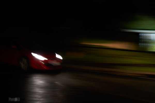 Passing car at night