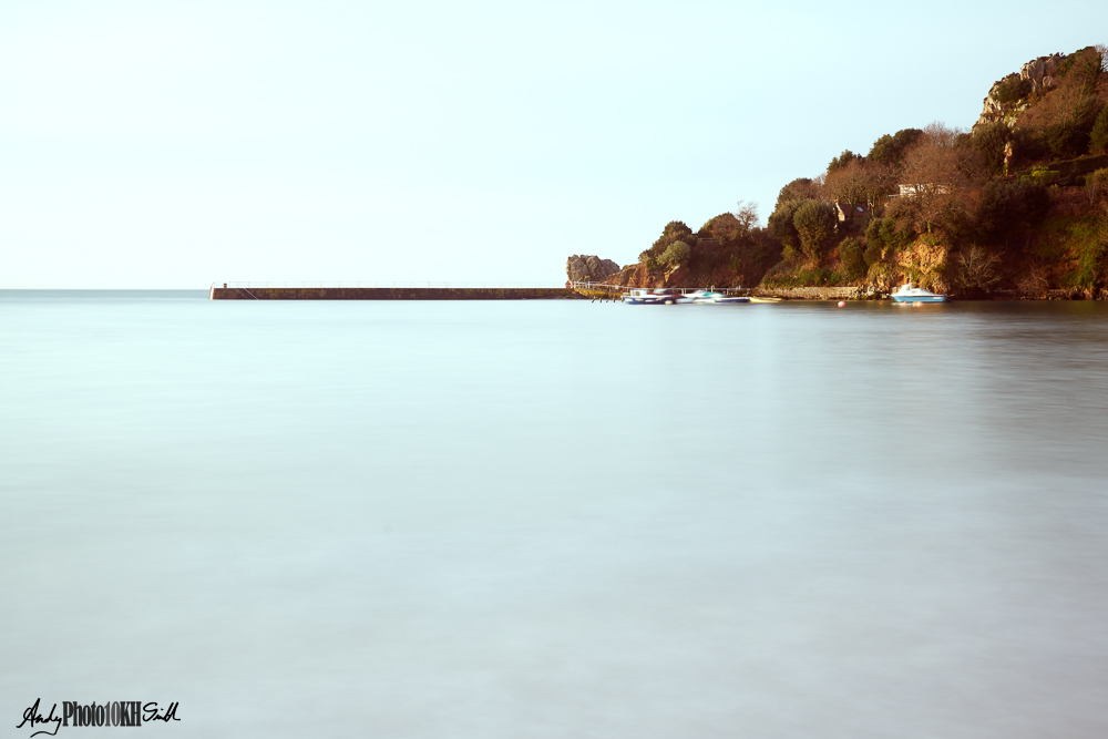 Minimalist image of harbour with a milky sea