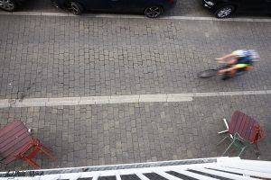 Blurred lycra clad cyclist entering the frame