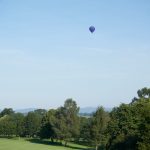 Hot air balloon over golf course