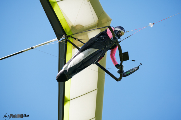 Close up of Hang Glider Pilot whilst being towed by a microlite