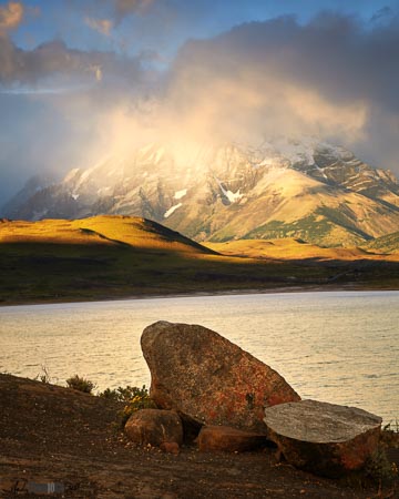 Sunrise mountain lake and boulder